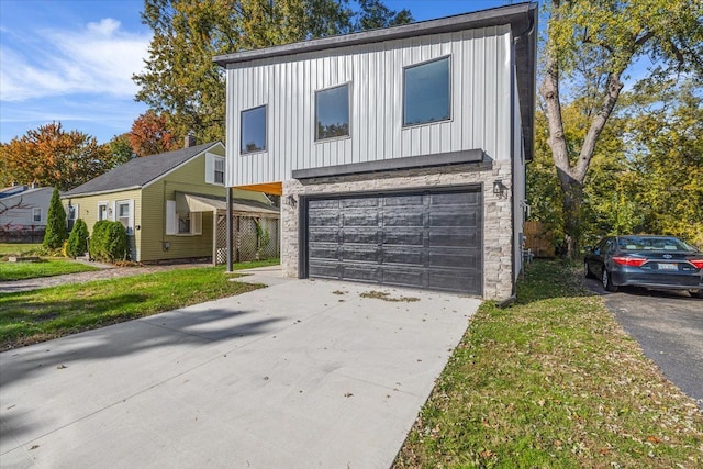 view of front of home with a garage and a front yard