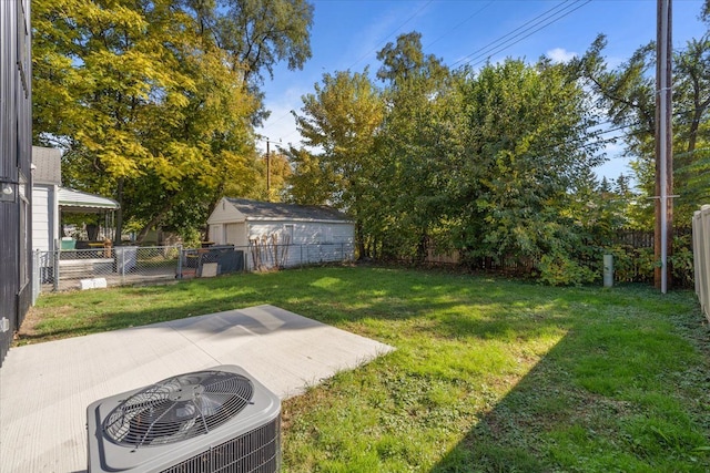 view of yard with a patio and central air condition unit