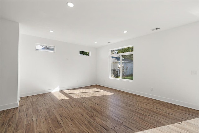 unfurnished room featuring hardwood / wood-style floors