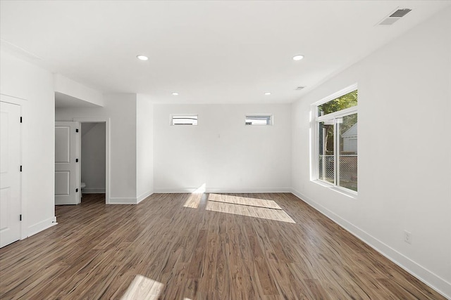 empty room featuring dark hardwood / wood-style flooring