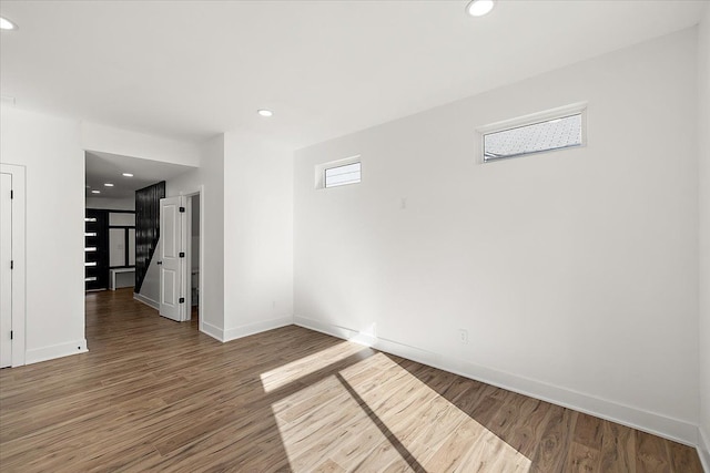 empty room featuring wood-type flooring