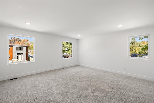 unfurnished room featuring carpet floors