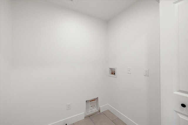 laundry room with washer hookup and light tile patterned floors