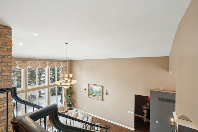 372 Overlook Dr, Oxford, MI 48371 - stairway featuring a chandelier, wood finished floors, and baseboards