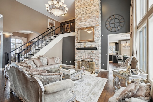 372 Overlook Dr, Oxford, MI 48371 - living room with stairway, hardwood / wood-style floors, a towering ceiling, and a fireplace