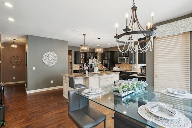 372 Overlook Dr, Oxford, MI 48371 - dining space with recessed lighting, baseboards, dark wood-style flooring, and an inviting chandelier