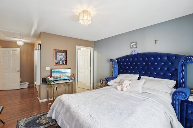 372 Overlook Dr, Oxford, MI 48371 - bedroom featuring attic access, baseboards, and wood finished floors
