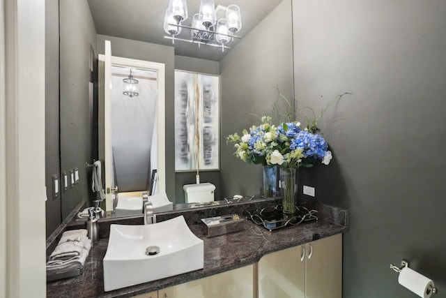 372 Overlook Dr, Oxford, MI 48371 - bathroom featuring a sink, a chandelier, and toilet