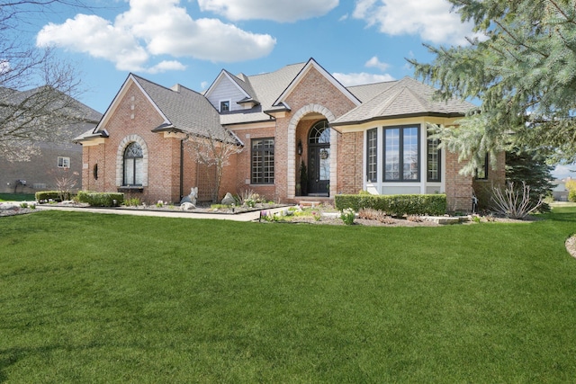 372 Overlook Dr, Oxford, MI 48371 - view of front of home with brick siding and a front yard