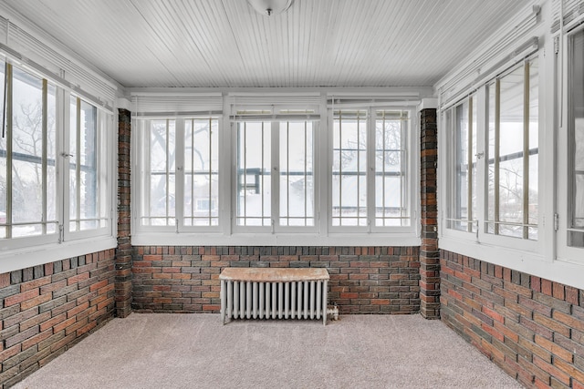 sunroom featuring radiator heating unit