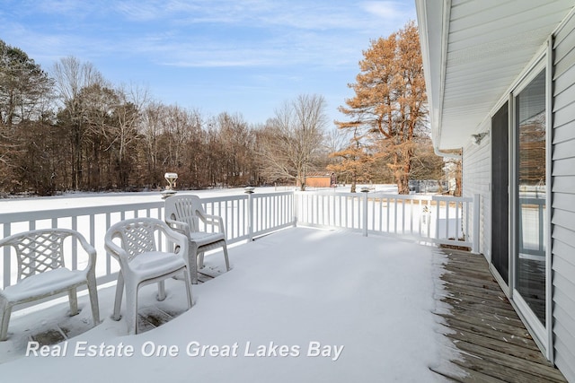 view of snow covered deck