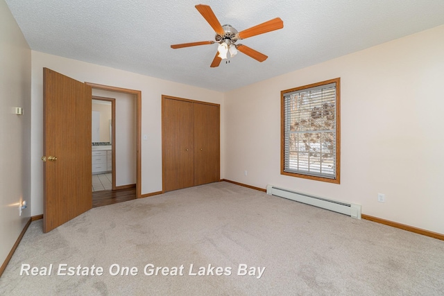 unfurnished bedroom with a textured ceiling, baseboard heating, light carpet, a closet, and ceiling fan