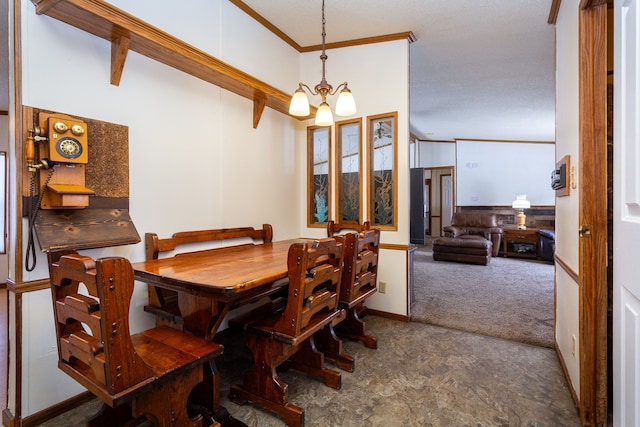 dining room with a notable chandelier, crown molding, and carpet