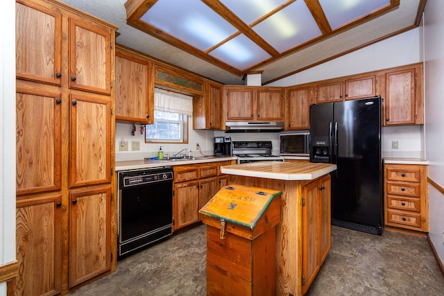 kitchen featuring lofted ceiling, sink, black appliances, a kitchen island, and tile countertops