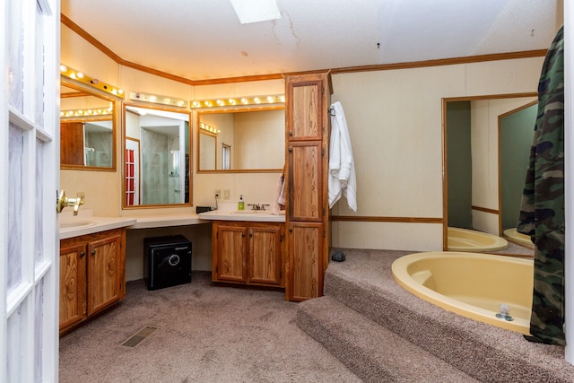 bathroom featuring ornamental molding, vanity, and a bath