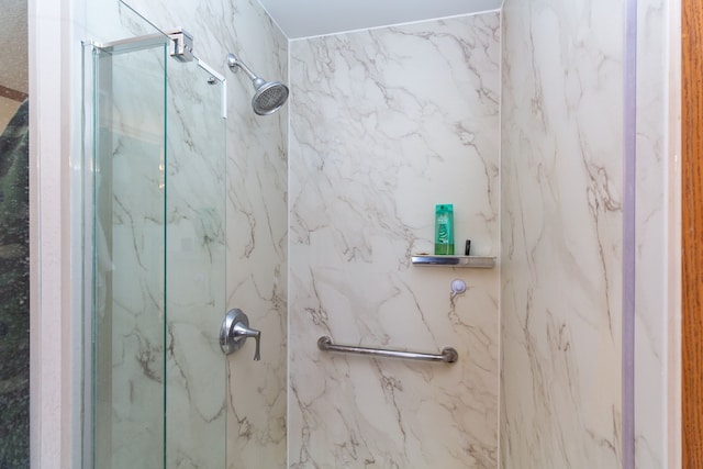 bathroom with a tile shower