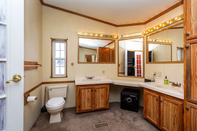 bathroom featuring crown molding, vanity, and toilet