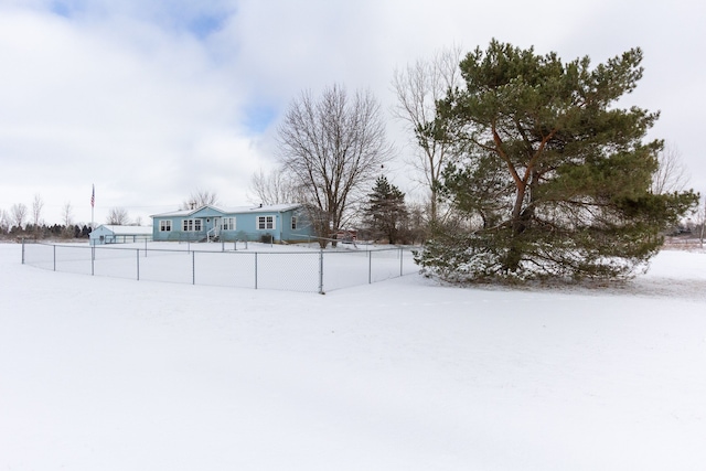 view of yard covered in snow