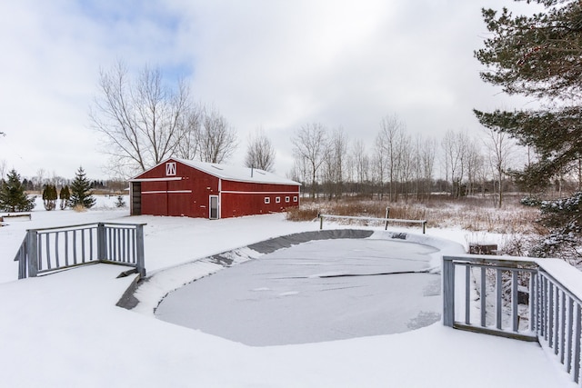 snowy yard with an outdoor structure