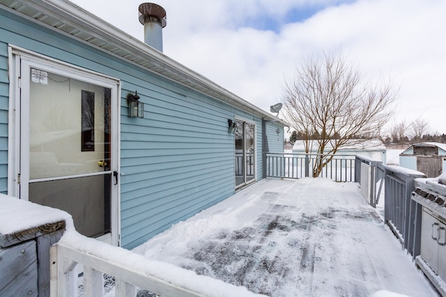 view of snow covered deck