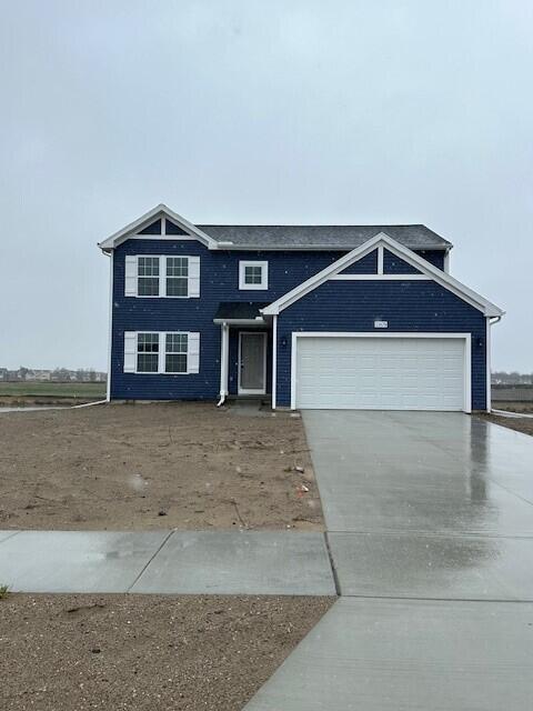 view of front of property featuring a garage