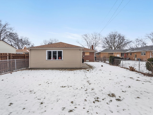 view of snow covered house