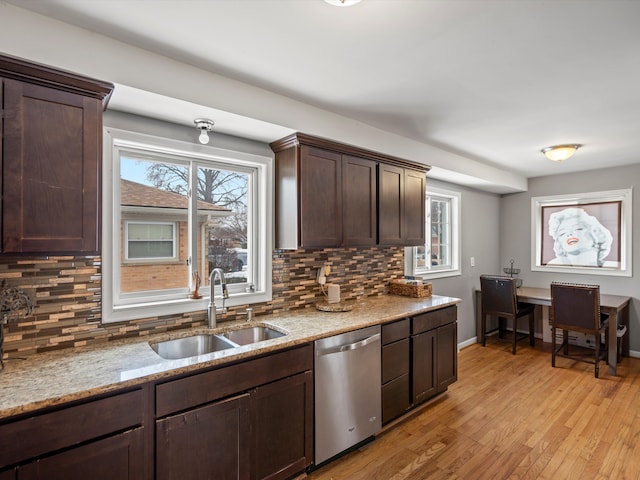 kitchen featuring dark brown cabinetry, sink, light hardwood / wood-style flooring, dishwasher, and decorative backsplash