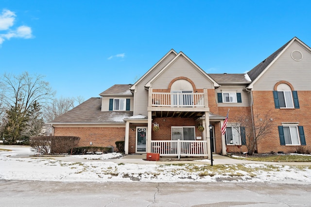 view of front of house featuring a porch and a balcony