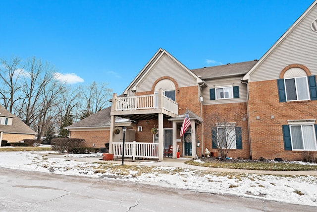 view of front of property with a balcony