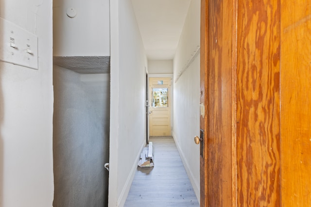 hallway with light wood-type flooring