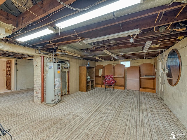 basement with carpet floors and gas water heater