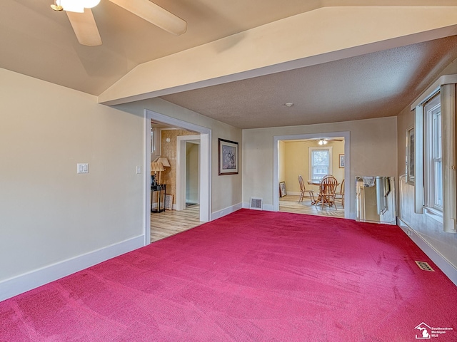 spare room with ceiling fan and lofted ceiling