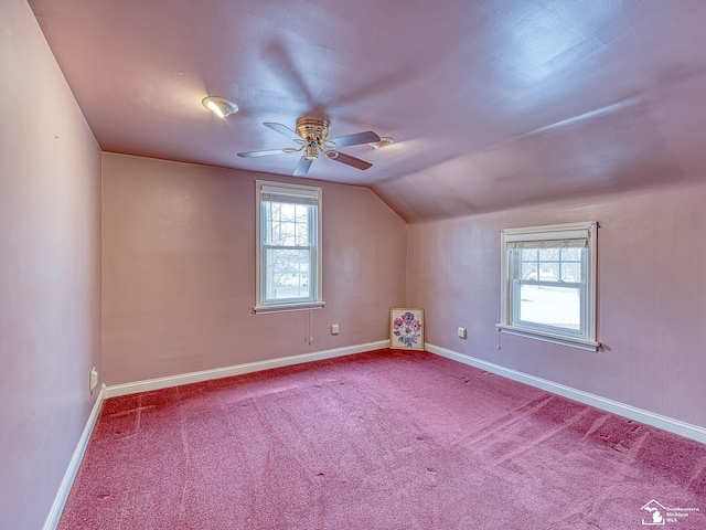 bonus room featuring lofted ceiling, ceiling fan, and carpet