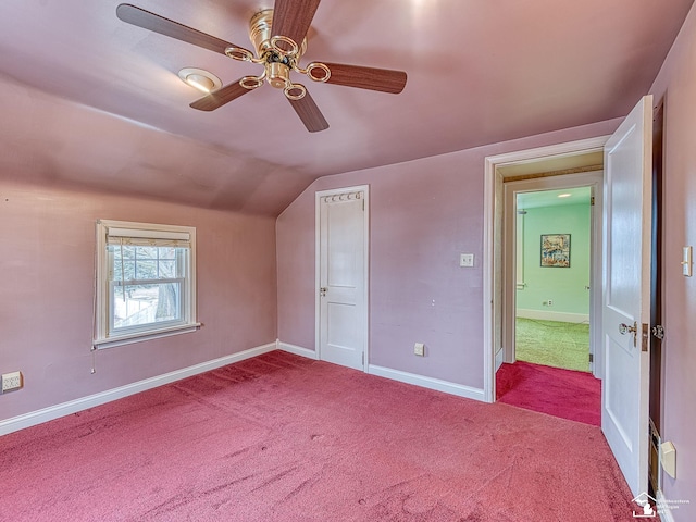 additional living space with lofted ceiling, light colored carpet, and ceiling fan