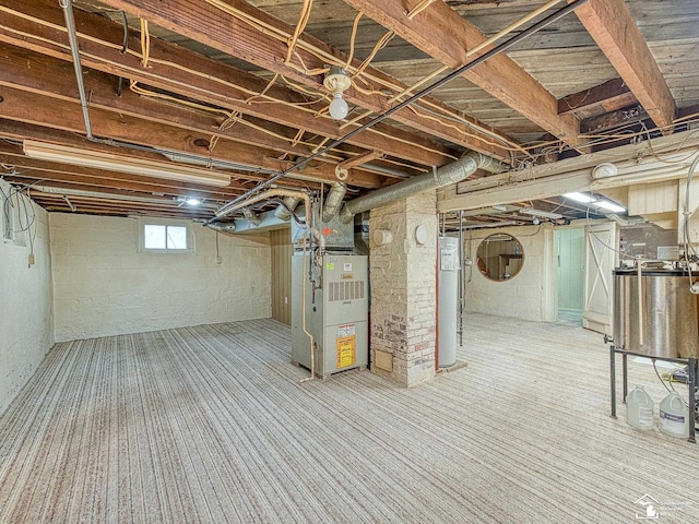 basement with heating unit, gas water heater, and carpet flooring