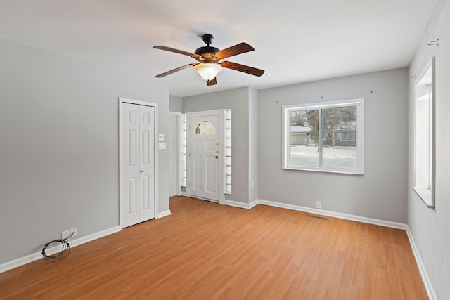 unfurnished room with ceiling fan and light hardwood / wood-style flooring