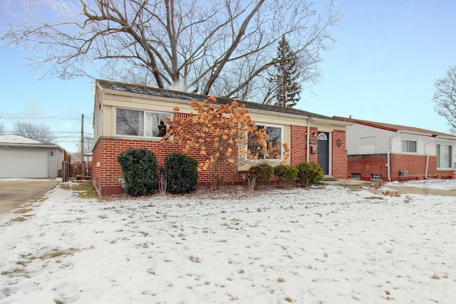 view of front of property featuring a garage and an outbuilding