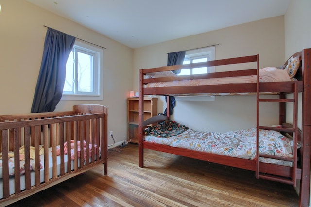 bedroom with wood-type flooring