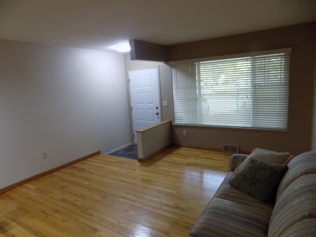 unfurnished living room with light wood-type flooring