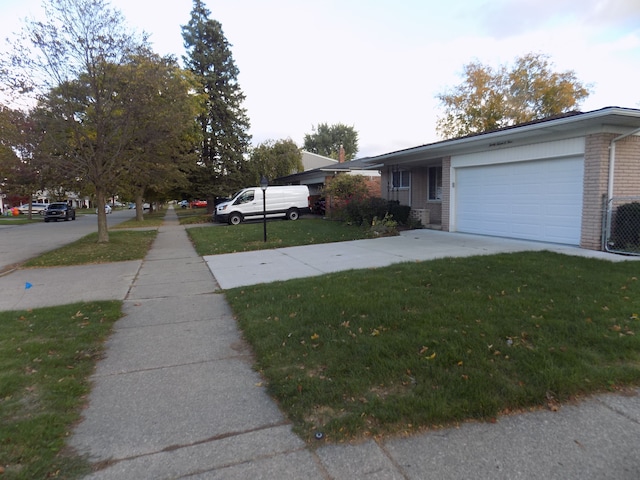 exterior space with a garage and a front yard