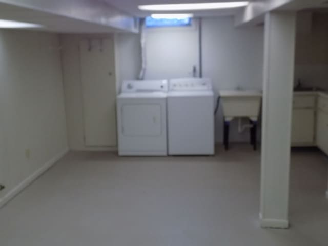 laundry room with washing machine and clothes dryer