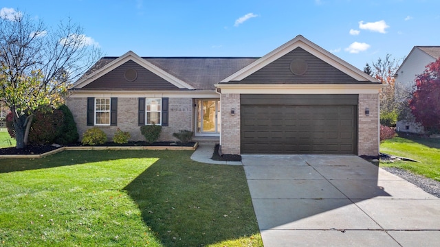 ranch-style house featuring a garage and a front lawn