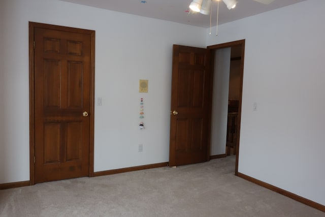 unfurnished bedroom featuring light colored carpet