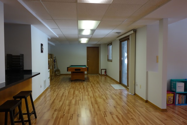 rec room with pool table, a drop ceiling, and light wood-type flooring