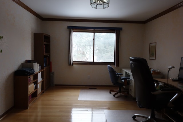 office featuring ornamental molding and light wood-type flooring