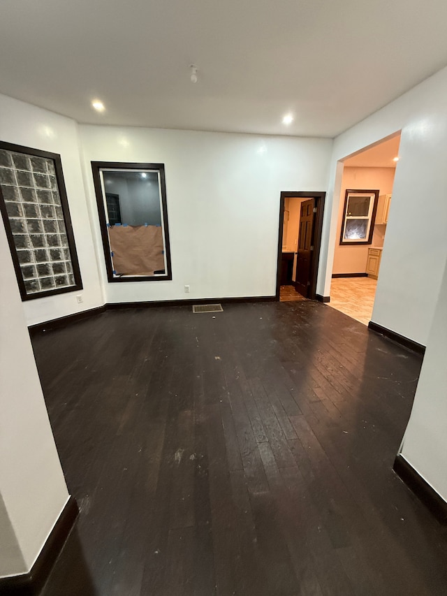 empty room with wood-type flooring