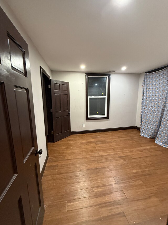 spare room with light wood-type flooring