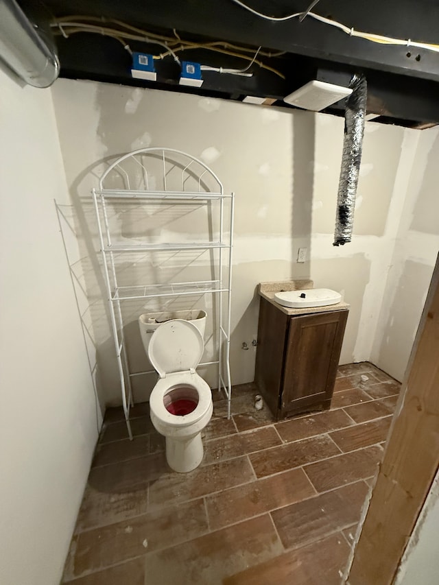 bathroom featuring vanity and toilet