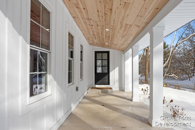 view of snow covered property entrance