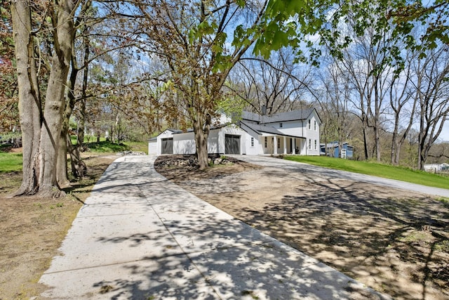 101 Carl Dr NE, Ada, MI 49301 - view of property exterior with driveway